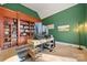 Bright home office featuring built-in shelving and custom desk, offering ample workspace at 20338 Christofle Dr, Cornelius, NC 28031