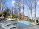 Gorgeous pool area with lake views, perfect for relaxing and entertaining in the beautiful outdoor space at 20338 Christofle Dr, Cornelius, NC 28031