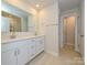 Modern bathroom with double vanity, sleek fixtures, and neutral-toned tiles at 2108 Morgan Hills Dr, Albemarle, NC 28001