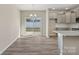 Bright kitchen and dining area featuring gray cabinets, stainless appliances, and sliding glass doors to the yard at 2124 Clapham Ct, Charlotte, NC 28215