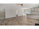 Open-concept living room and kitchen featuring hard surface floors, neutral paint, and modern finishes at 2124 Clapham Ct, Charlotte, NC 28215