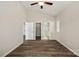 Large main bedroom with high ceilings, wood-look floors, and en-suite bathroom featuring a glass enclosed shower at 2124 Clapham Ct, Charlotte, NC 28215