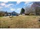 A large backyard with a mix of grassy areas and features at 240 Old Limestone E Rd, York, SC 29745