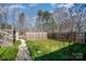 Fenced backyard featuring a stone pathway and lush green ground cover at 240 Old Limestone E Rd, York, SC 29745