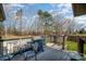 Outdoor deck area with a grill, seating, and view of the natural surroundings at 240 Old Limestone E Rd, York, SC 29745