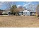 Blue house exterior with partial lawn and mature trees surrounding the property at 240 Old Limestone E Rd, York, SC 29745