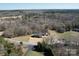 Aerial view of the house with a pool and wooded surrounding at 257 Hickory Hill Ln, Stanley, NC 28164