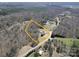 Overhead view of a home surrounded by trees, showcasing its spacious lot at 257 Hickory Hill Ln, Stanley, NC 28164