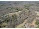 Aerial view of homes with swimming pools in a rural setting at 257 Hickory Hill Ln, Stanley, NC 28164