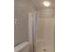 Bathroom featuring a toilet and shower with white shower curtain at 257 Hickory Hill Ln, Stanley, NC 28164