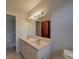 Bathroom showcasing a dual sink vanity, large mirror, and neutral walls at 257 Hickory Hill Ln, Stanley, NC 28164