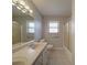 Bathroom featuring a toilet, tub, and shower with gold toned fixtures at 257 Hickory Hill Ln, Stanley, NC 28164