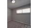 Cozy bedroom with carpet, neutral paint, and natural light streaming through the window at 257 Hickory Hill Ln, Stanley, NC 28164