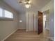 Bedroom featuring wood floors, a ceiling fan, and a closet at 257 Hickory Hill Ln, Stanley, NC 28164