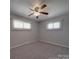 Bedroom featuring a ceiling fan, carpet, and bright light from the window at 257 Hickory Hill Ln, Stanley, NC 28164