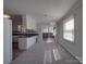 Dining area with carpet, chandelier, and sliding glass doors to a screened porch at 257 Hickory Hill Ln, Stanley, NC 28164