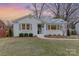 Lovely one-story white brick home with a well-maintained lawn and green shutters at 3504 Meredith Ave, Charlotte, NC 28208