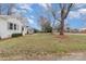 Inviting one-story white brick home featuring a well-kept lawn and curb appeal, with green shutters at 3504 Meredith Ave, Charlotte, NC 28208