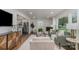 Open-concept living room flowing into the kitchen, featuring stylish furniture and ample natural light at 3504 Meredith Ave, Charlotte, NC 28208