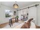 Inviting home office with natural light, neutral color scheme, sliding barn door and hardwood floors at 3504 Meredith Ave, Charlotte, NC 28208