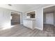 Bright dining area with light gray walls, wood-look flooring, and a granite-topped serving bar at 4211 Little Mountain Rd, Gastonia, NC 28056