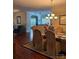 Elegant dining area with a chandelier, hardwood flooring, and access to the living room at 422 Drake Ln, Salisbury, NC 28146