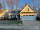 Charming one-story home featuring a two-car garage, manicured lawn, and stone accents at 422 Drake Ln, Salisbury, NC 28146