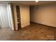 Spacious finished basement area with wood-look floors and ample storage space at 424 20Th Ne Ave, Hickory, NC 28601