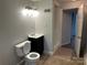 This bathroom features tile floors, a toilet, and a shower with tile walls at 424 20Th Ne Ave, Hickory, NC 28601