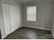 Cozy bedroom features a built in closet, neutral walls and hardwood floors at 424 20Th Ne Ave, Hickory, NC 28601