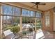 This back porch looks out over the pool and fire pit at 425 Gladelynn Way, Waxhaw, NC 28173