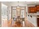 Charming dining area featuring a chandelier, natural light, and hardwood floors at 425 Gladelynn Way, Waxhaw, NC 28173