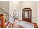 Elegant foyer with wood floors, decorative front door, and detailed trim work at 425 Gladelynn Way, Waxhaw, NC 28173