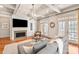 Comfortable living room featuring a fireplace, hardwood floors, and natural lighting at 425 Gladelynn Way, Waxhaw, NC 28173