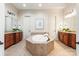 This expansive main bathroom has a large tub, double sinks and tile floors at 425 Gladelynn Way, Waxhaw, NC 28173