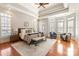 This spacious main bedroom has tray ceilings, many windows and hardwood floors at 425 Gladelynn Way, Waxhaw, NC 28173