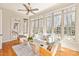 Bright sunroom with large windows offers a relaxing space with plenty of natural light at 425 Gladelynn Way, Waxhaw, NC 28173