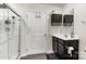 This bathroom features a glass door shower and updated vanity at 4255 Wild Ridge Dr, Charlotte, NC 28215