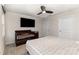 This bedroom features neutral walls, carpet, a ceiling fan and a crib at 4255 Wild Ridge Dr, Charlotte, NC 28215