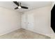 Neutral bedroom with a ceiling fan, carpet, and two closets offer a clean and simple design at 4255 Wild Ridge Dr, Charlotte, NC 28215