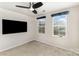 This bedroom features neutral walls, carpet, and a ceiling fan at 4255 Wild Ridge Dr, Charlotte, NC 28215