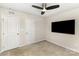 This bedroom features neutral walls, carpet, and a ceiling fan at 4255 Wild Ridge Dr, Charlotte, NC 28215