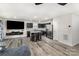 Open-concept living room featuring dark cabinets, granite countertops, and a large sofa at 4255 Wild Ridge Dr, Charlotte, NC 28215