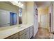 Bright bathroom featuring white cabinets, a large mirror, and tile flooring at 427 Kentmere Ln, Lake Wylie, SC 29710