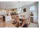 The dining room is adjacent to the modern kitchen in this open-concept home design at 427 Kentmere Ln, Lake Wylie, SC 29710