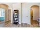 Bright hallway with decorative shelving, white doors, and neutral walls at 427 Kentmere Ln, Lake Wylie, SC 29710