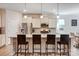 Modern kitchen with stainless steel appliances, granite counters, and breakfast bar seating at 427 Kentmere Ln, Lake Wylie, SC 29710