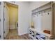 Organized mudroom with built-in bench, shelving, and hooks for storage at 427 Kentmere Ln, Lake Wylie, SC 29710