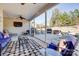 Inviting screened-in porch with ceiling fan, TV, comfortable seating, and access to the outdoor patio at 427 Kentmere Ln, Lake Wylie, SC 29710