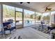 Inviting screened porch with comfortable seating and a view of the landscaped backyard at 427 Kentmere Ln, Lake Wylie, SC 29710